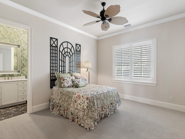 bedroom featuring ornamental molding, sink, light colored carpet, ceiling fan, and ensuite bathroom