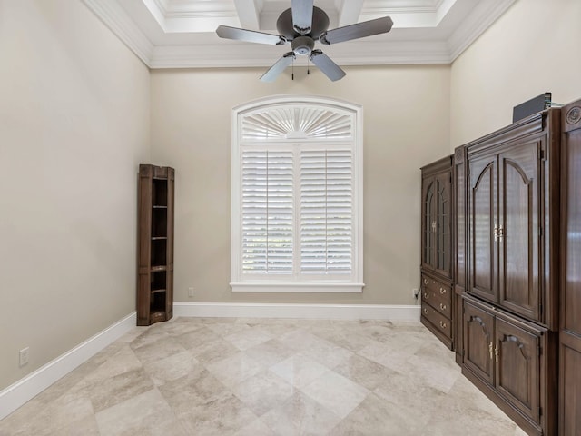 spare room with ornamental molding and ceiling fan