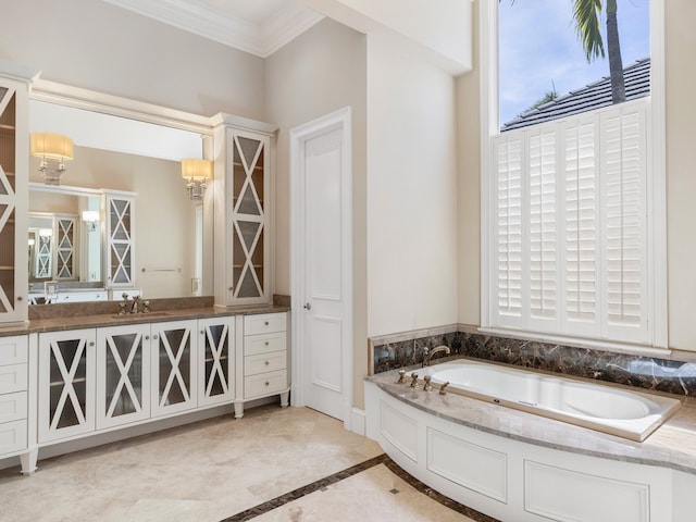 bathroom featuring vanity, a bathtub, and crown molding