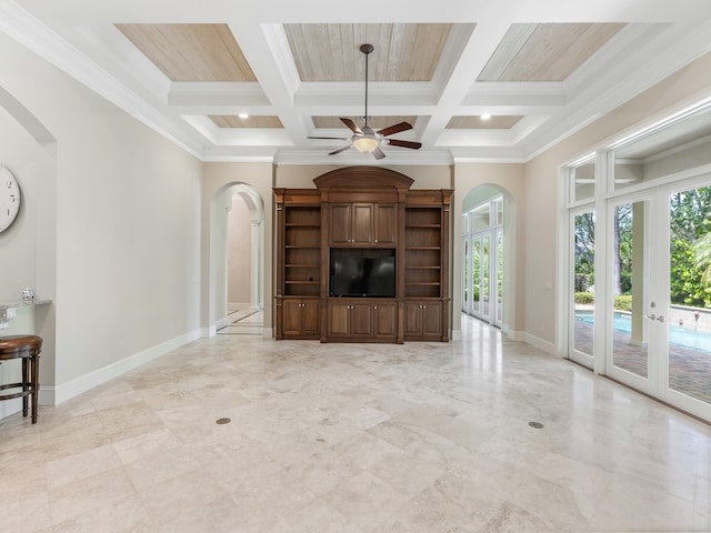 unfurnished living room with french doors, crown molding, coffered ceiling, beamed ceiling, and ceiling fan