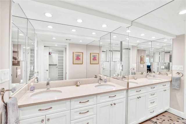 bathroom with tile patterned floors and vanity