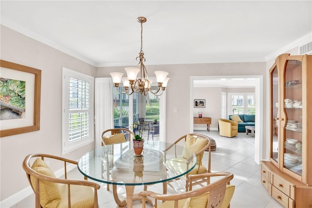 dining room featuring an inviting chandelier, plenty of natural light, ornamental molding, and light tile patterned flooring