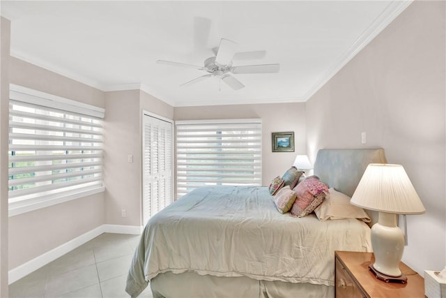 tiled bedroom with multiple windows, crown molding, a closet, and ceiling fan