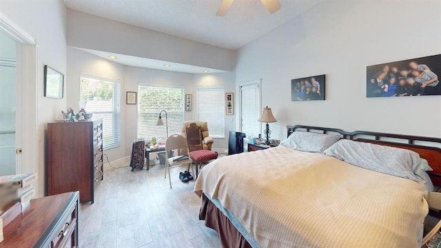 bedroom with light hardwood / wood-style floors and ceiling fan