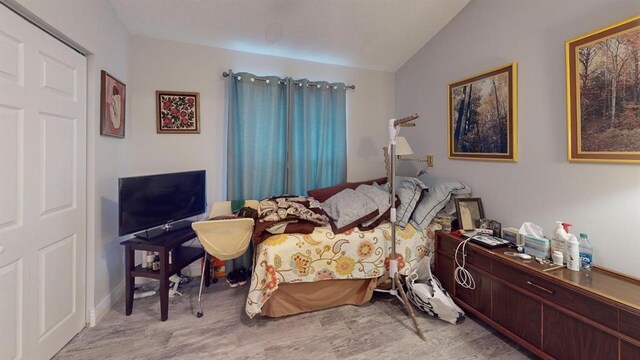 bedroom with lofted ceiling