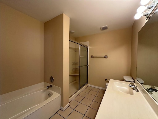 full bathroom with vanity, tile patterned floors, independent shower and bath, and toilet