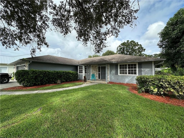 ranch-style house with a garage and a front yard