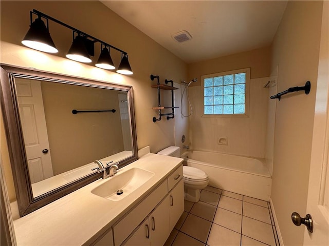 full bathroom with vanity, toilet, tiled shower / bath combo, and tile patterned flooring