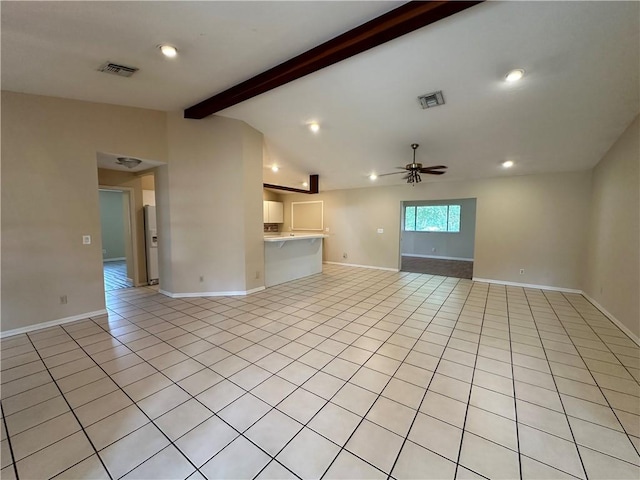 unfurnished living room with lofted ceiling with beams, light tile patterned flooring, and ceiling fan