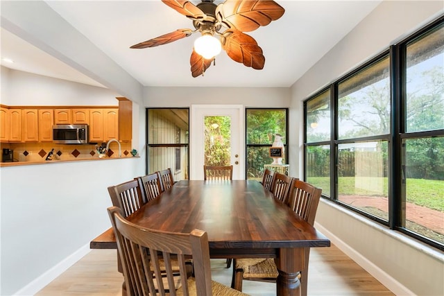 dining area featuring light wood-type flooring