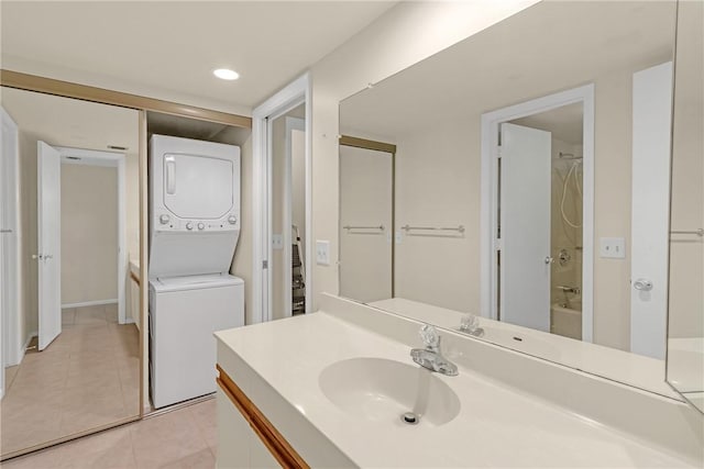 12 Plantation Dr Unit 205, Vero Beach, FL 32966 - full bath featuring stacked washer / drying machine, vanity, tile patterned floors, and bathing tub / shower combination