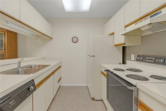 12 Plantation Dr Unit 205, Vero Beach, FL 32966 - kitchen with white appliances, under cabinet range hood, light countertops, and white cabinets