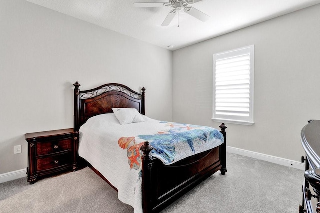 bedroom with ceiling fan and light colored carpet