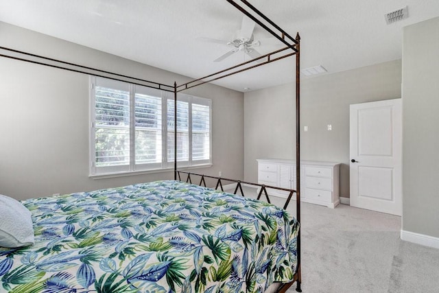 bedroom featuring ceiling fan and light carpet