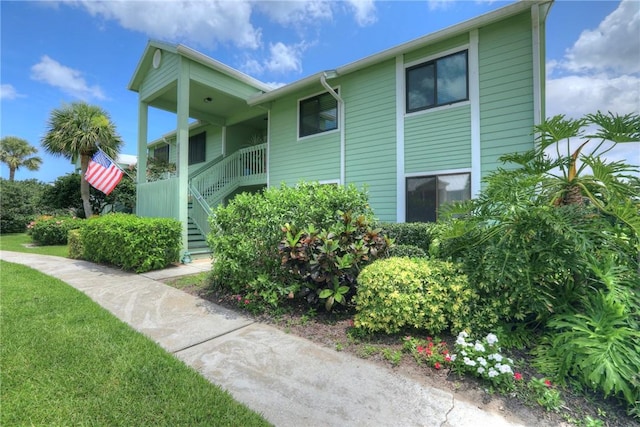 5725 Pelican Pointe Dr Unit 4, Sebastian, FL 32958 - view of property featuring stairs