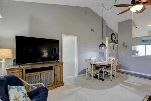 5725 Pelican Pointe Dr Unit 4, Sebastian, FL 32958 - living area featuring ceiling fan, high vaulted ceiling, baseboards, and light colored carpet