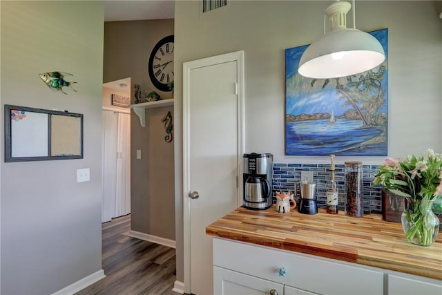 5725 Pelican Pointe Dr Unit 4, Sebastian, FL 32958 - hallway with dark wood finished floors and baseboards