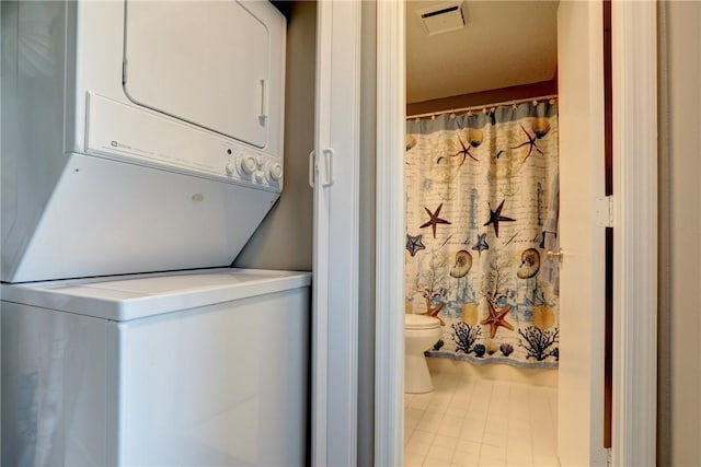 5725 Pelican Pointe Dr Unit 4, Sebastian, FL 32958 - washroom with stacked washer and clothes dryer