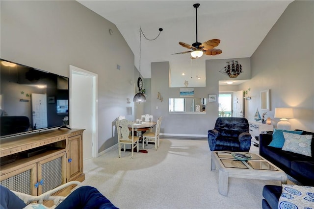 5725 Pelican Pointe Dr Unit 4, Sebastian, FL 32958 - living area with high vaulted ceiling, light carpet, ceiling fan, and baseboards