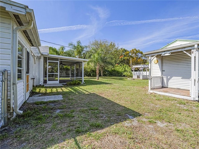 view of yard with a sunroom