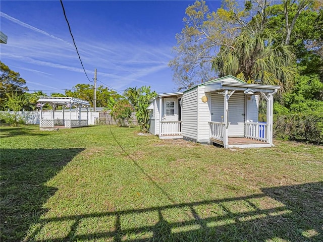 view of yard with fence and a pergola