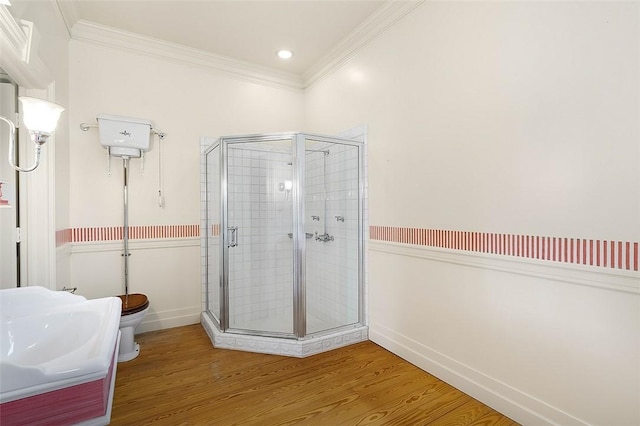201 Sundial Ct, Vero Beach, FL 32963 - full bathroom with a shower stall, crown molding, wood finished floors, toilet, and baseboards