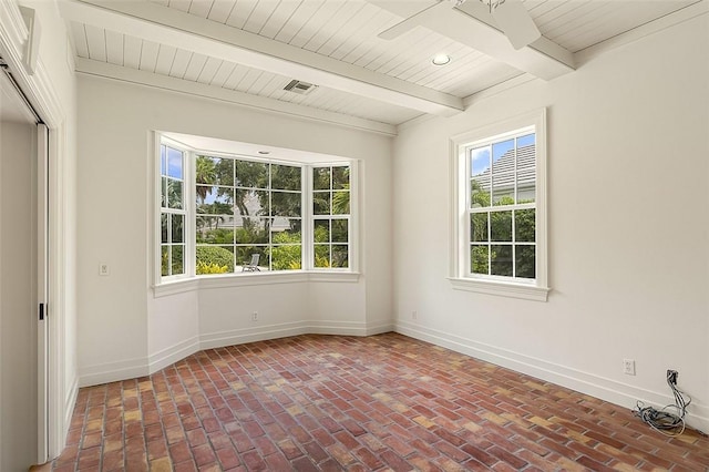 201 Sundial Ct, Vero Beach, FL 32963 - spare room with plenty of natural light, beam ceiling, brick flooring, baseboards, and wood ceiling