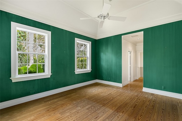 spare room with ornamental molding, hardwood / wood-style floors, and ceiling fan