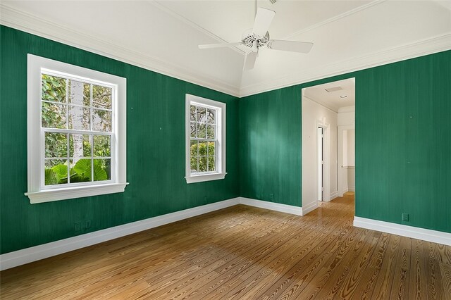 spare room with ornamental molding, hardwood / wood-style floors, and ceiling fan