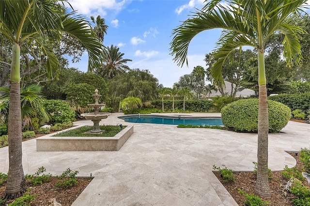 view of swimming pool featuring a patio area