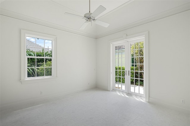 spare room featuring french doors, ceiling fan, and crown molding