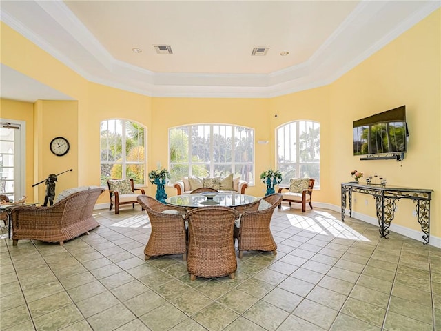5095 Fairways Cir Unit I203, Vero Beach, FL 32967 - dining area featuring light tile patterned flooring, a raised ceiling, and crown molding