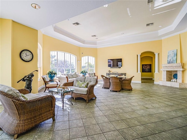 5095 Fairways Cir Unit I203, Vero Beach, FL 32967 - tiled living area with a raised ceiling, arched walkways, and ornamental molding