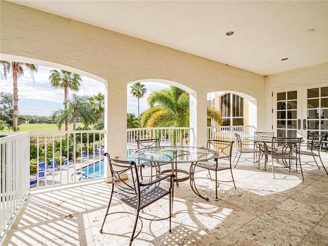 5095 Fairways Cir Unit I203, Vero Beach, FL 32967 - view of patio / terrace featuring outdoor dining space and french doors