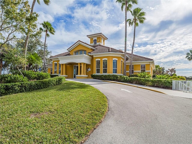 5095 Fairways Cir Unit I203, Vero Beach, FL 32967 - view of front of home featuring a tile roof, stucco siding, and curved driveway