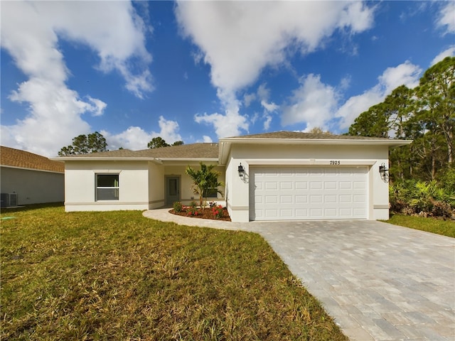 ranch-style house featuring a garage and a front lawn