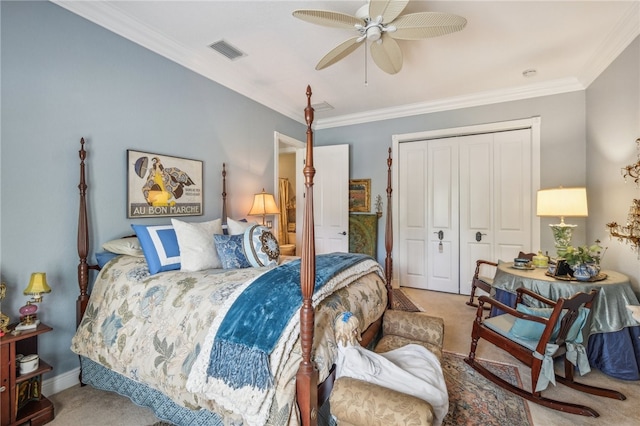 bedroom featuring a closet, carpet flooring, ceiling fan, and crown molding