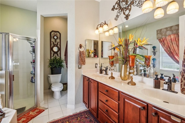 bathroom featuring walk in shower, tile patterned flooring, vanity, and toilet