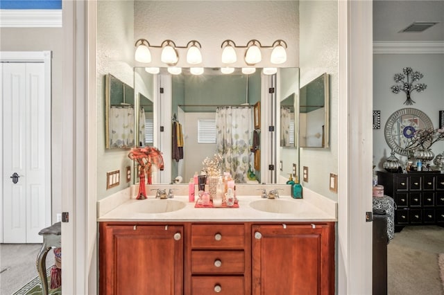 bathroom featuring vanity and ornamental molding