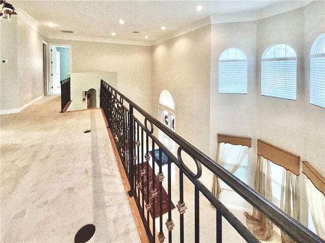 carpeted living room with a textured ceiling and ornamental molding