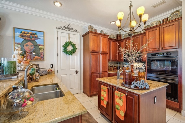 kitchen featuring light tile patterned flooring, crown molding, decorative light fixtures, sink, and double oven