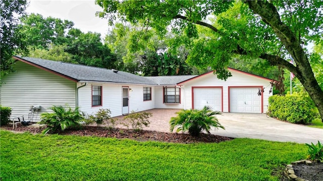 930 47th Ave SW, Vero Beach, FL 32968 - single story home featuring an attached garage, driveway, a front lawn, and a shingled roof