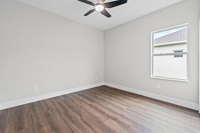 unfurnished room with wood-type flooring, a wealth of natural light, and ceiling fan