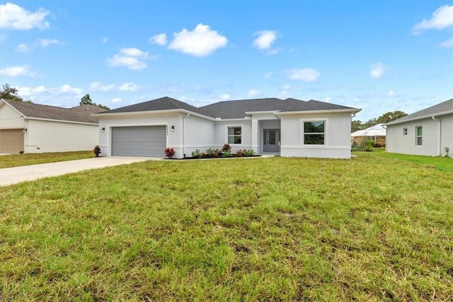 ranch-style home featuring a front yard and a garage