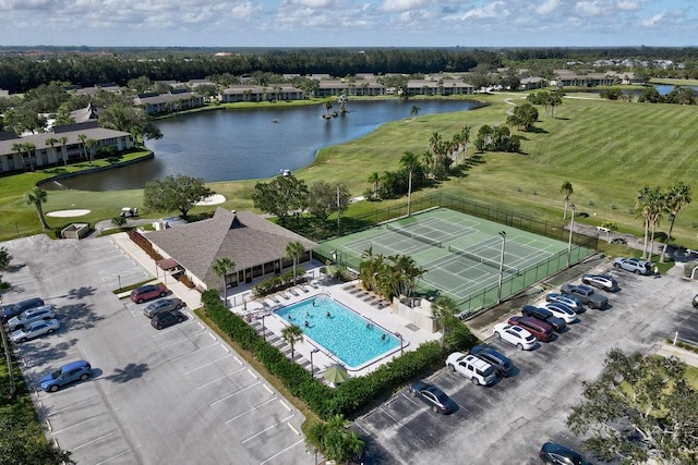 bird's eye view featuring a water view and view of golf course