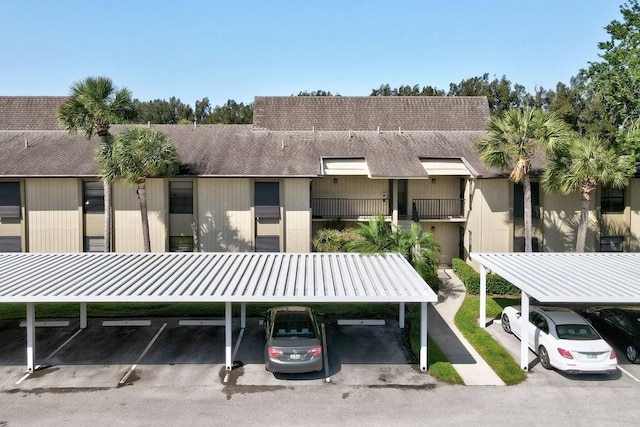 view of property featuring covered parking