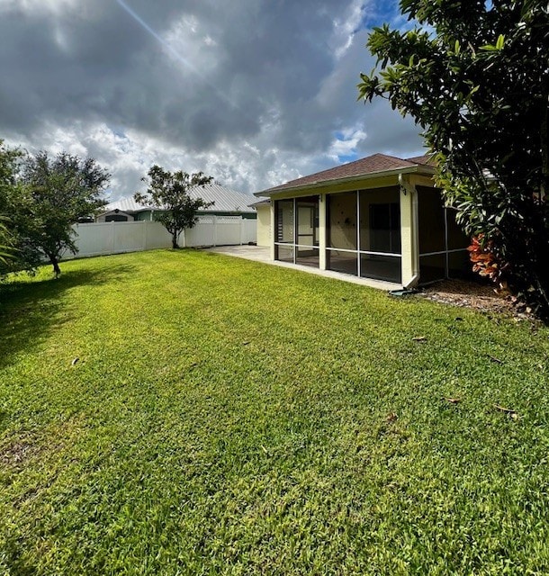 8036 105th Ct, Vero Beach, FL 32967 - view of yard with a sunroom