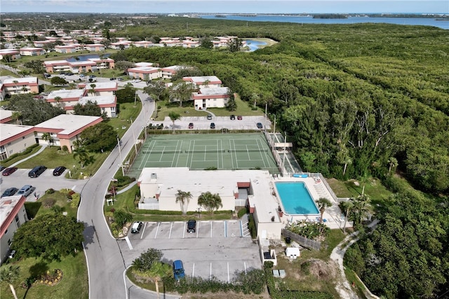 birds eye view of property with a water view