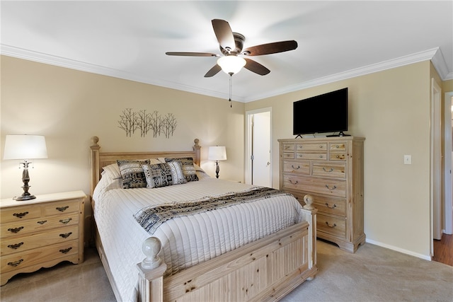 bedroom with ceiling fan, light carpet, and ornamental molding