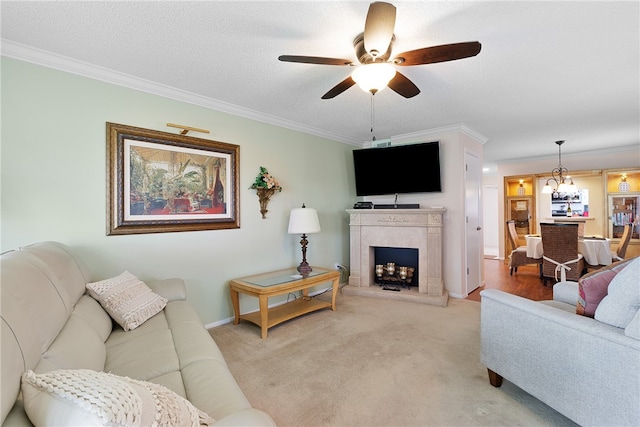 carpeted living room featuring a textured ceiling, crown molding, and ceiling fan with notable chandelier